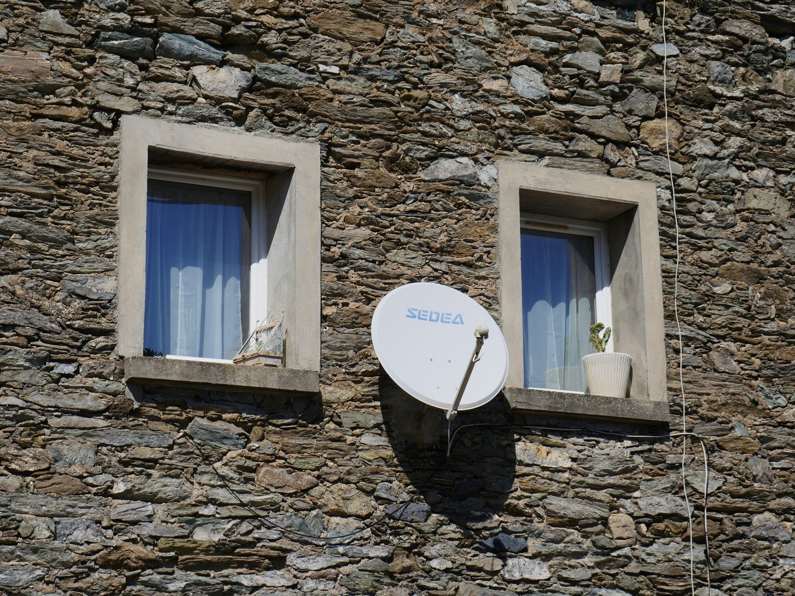 Satellite dish protected by digital lock symbolizing encryption